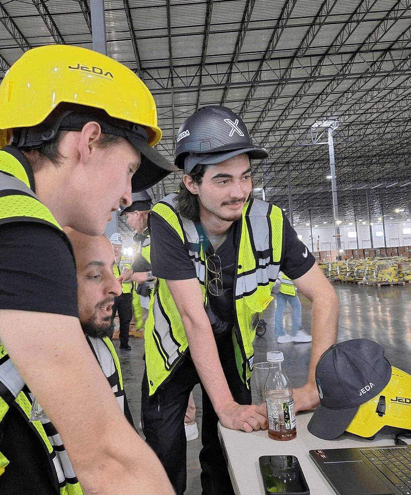 Jeda technicians collaborating during onsite planning.