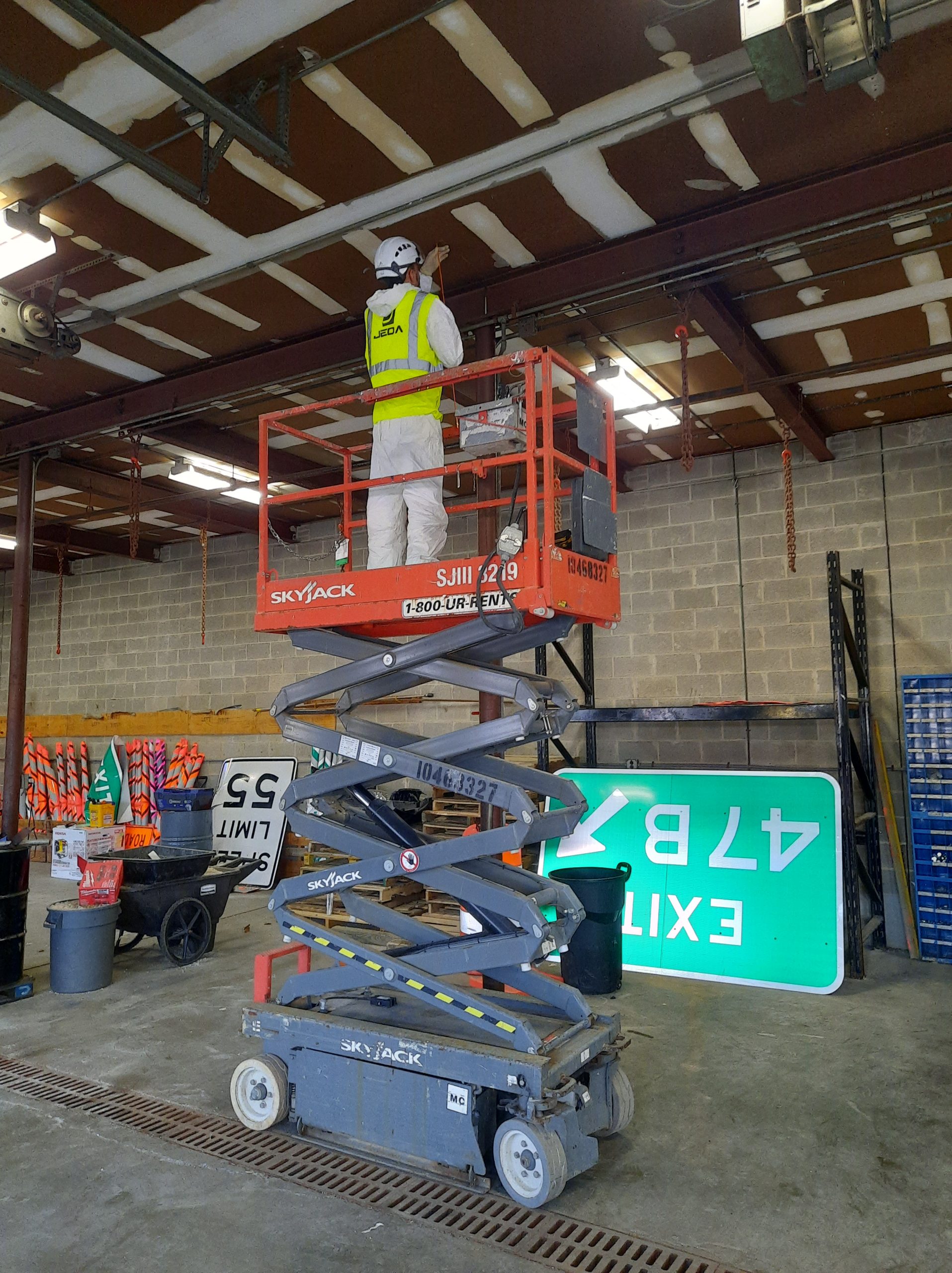 Jeda technicians installing network infrastructure from an aerial lift.